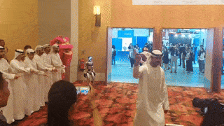 GIF showcases a performance of the Al-Ayyala alongside a lion dance during the opening ceremony of GITEX Asia 2025.