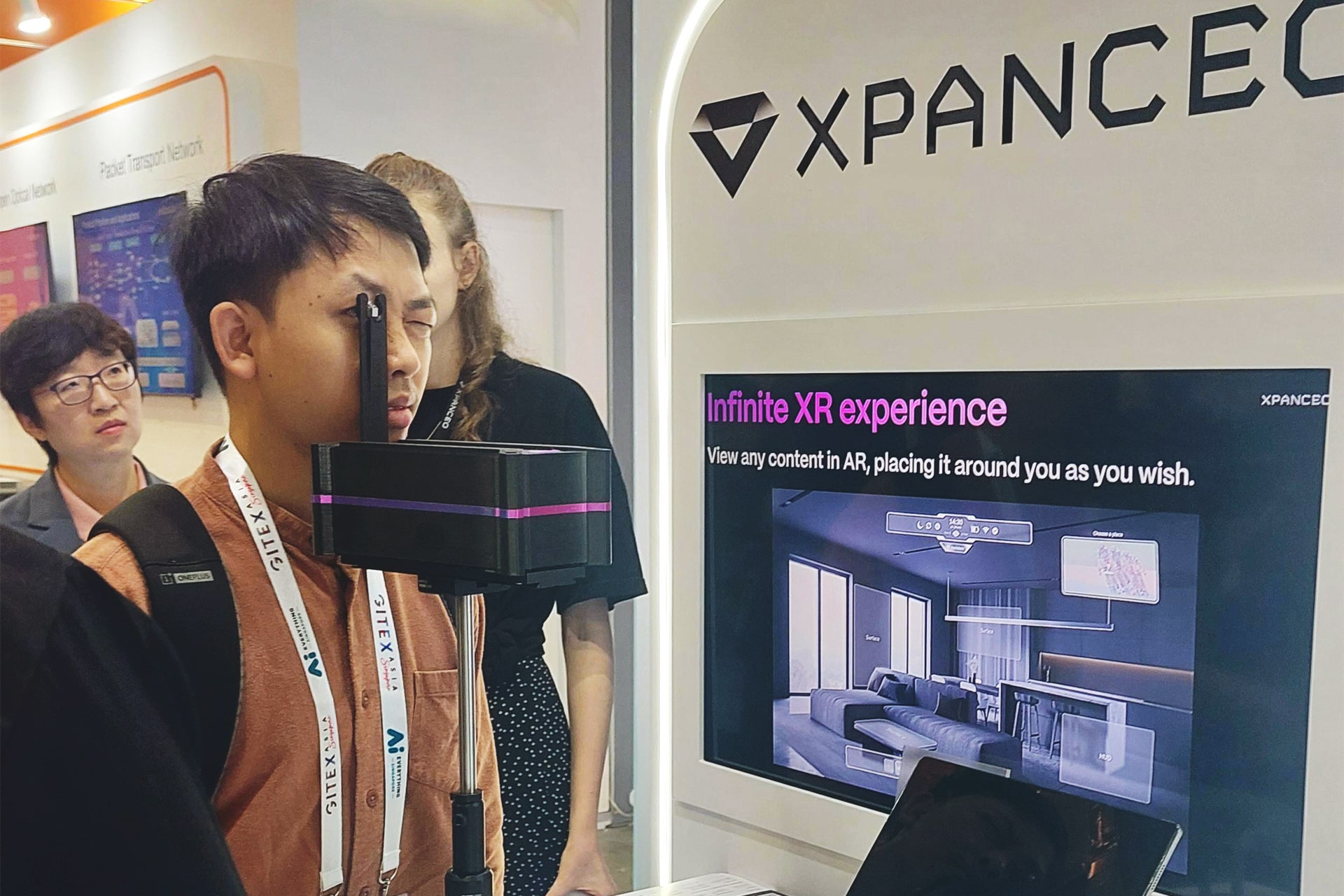 Photo shows a journalist from the international media delegation trying a prototype of Xpanceo’s smart contact lenses, brought to GITEX Asia 2025 by the Dubai-based startup.
