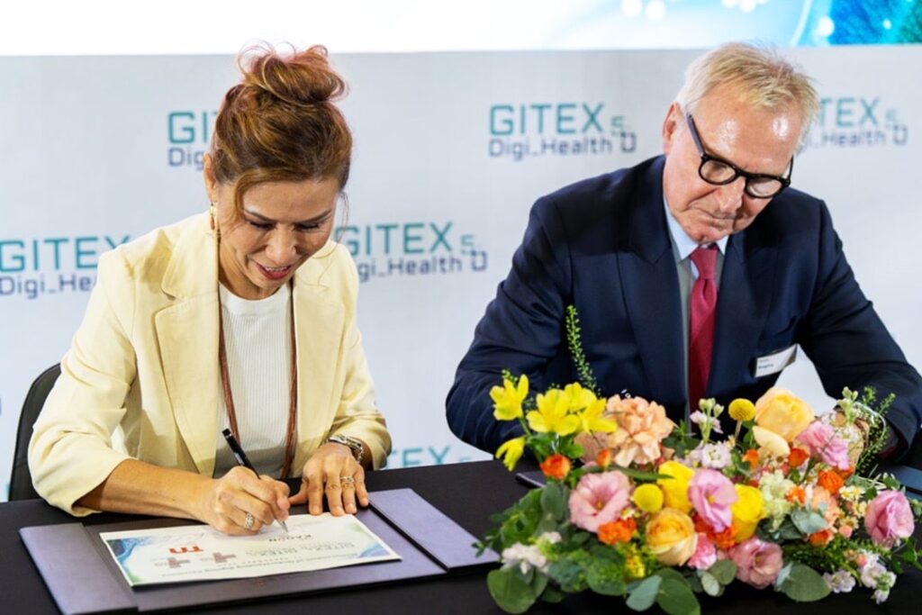 Photo of Trixie LohMirmand (left), CEO of Kaoun International, and Gernot Ringling, managing director of Messe Dusseldorf Asia, signing a partnership agreement for the Thailand edition of GITEX Digi Health 5.0, set for September 2025. The signing took place on the sidelines of Medical Fair Asia 2024.